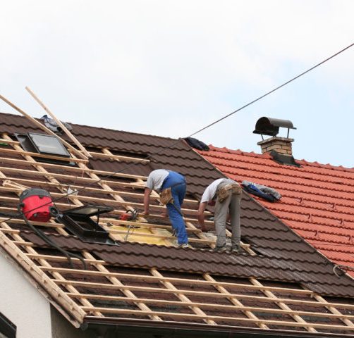 Two,Men,Working,On,The,Roof